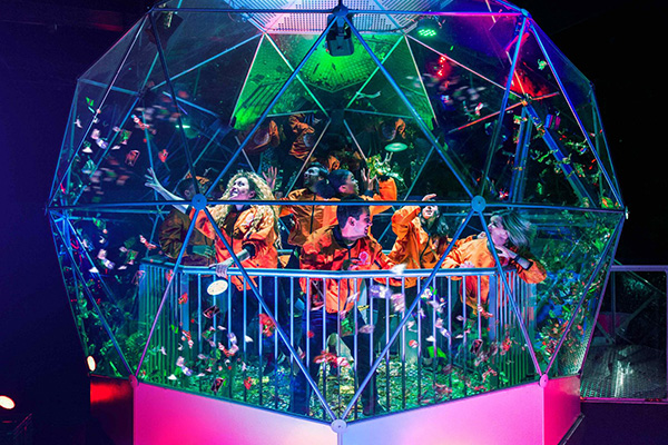 A group playing a team building game at a business social event